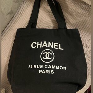 Chanel canvas tote bag. Use as a tote for the beach, groceries, books!